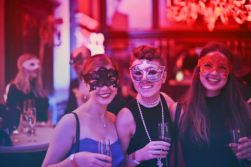 Women wearing masks in the party