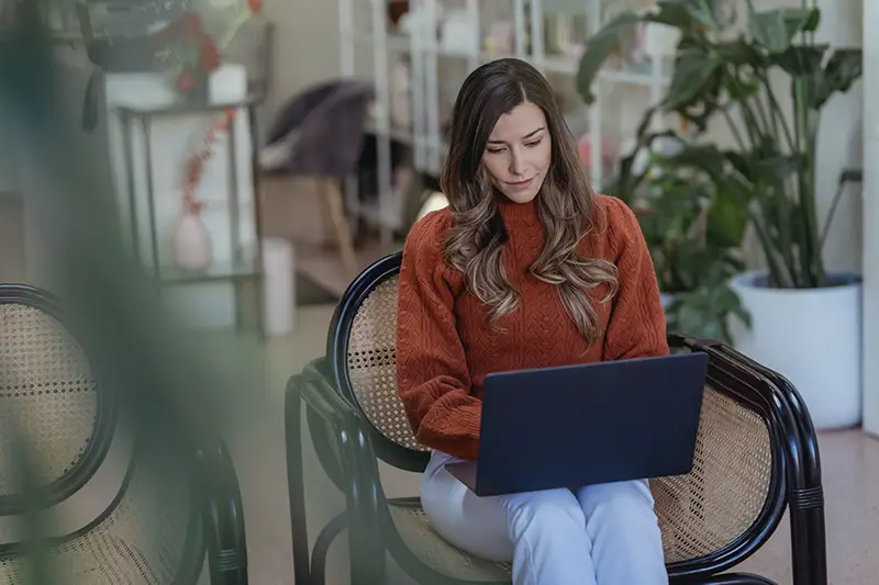 Woman entrepreneur working on her laptop