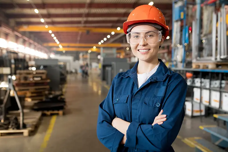 Young smiling female technician in blue uniform,