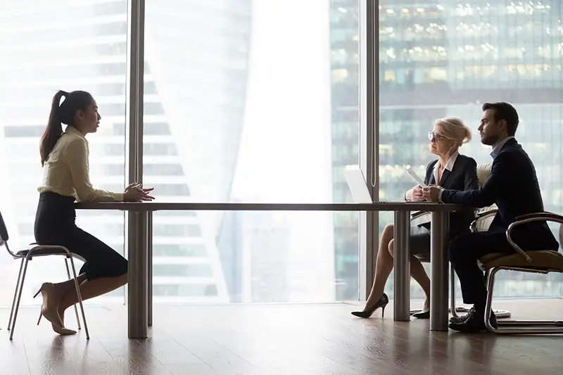 Asian applicant introducing talking to hr managers at job interview