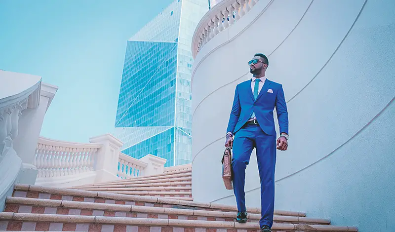 Businessman wearing blue suit standing in the stair