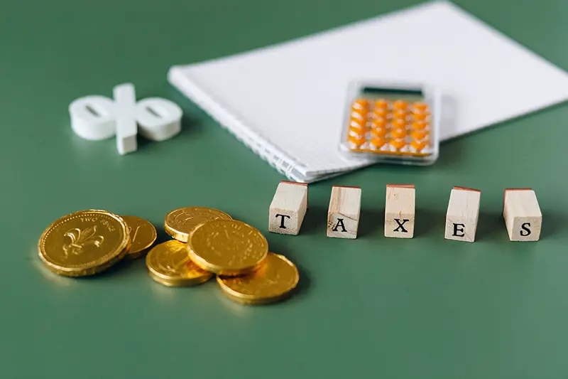 Gold coins on green surface