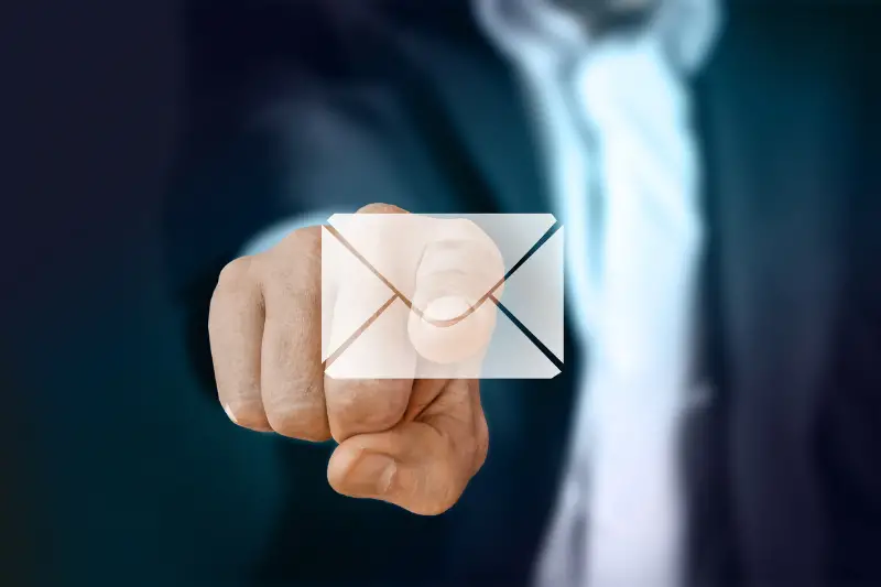 Businessman pressing an email button design
