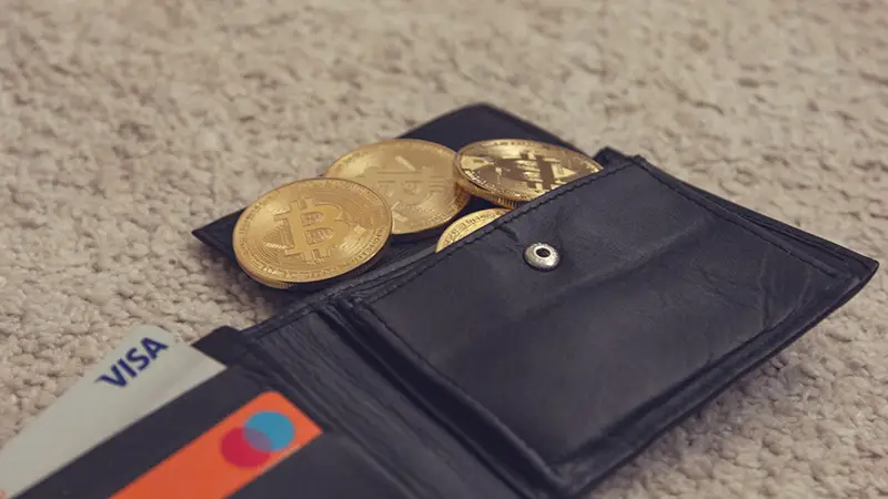 Black leather bifold wllet with gold round coins