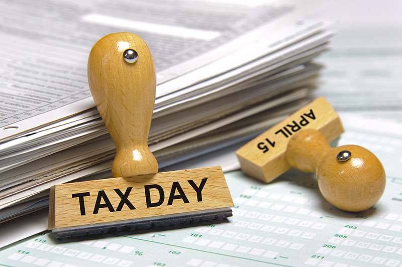 Tax day april 15th marked on two rubber stamps