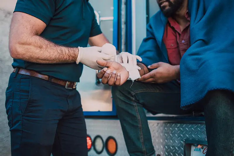 Paramedic administering first aid