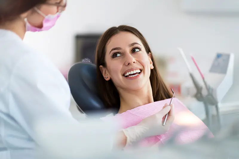 Dentist and patient in dentist office