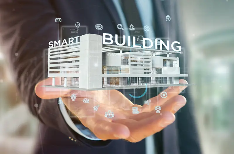Businessman holding a Smart building connected - 3d rendering