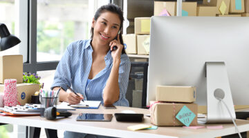 Business owner working with computer at home