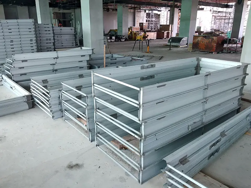 Mild Steel Door Frame stacked horizontally at the construction site.