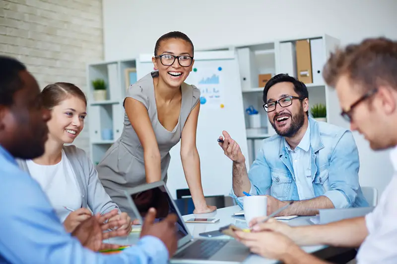 group of people, facing one another, having a meeting