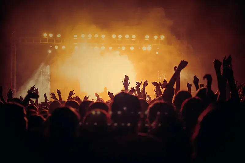 Band performing on stage in front of people