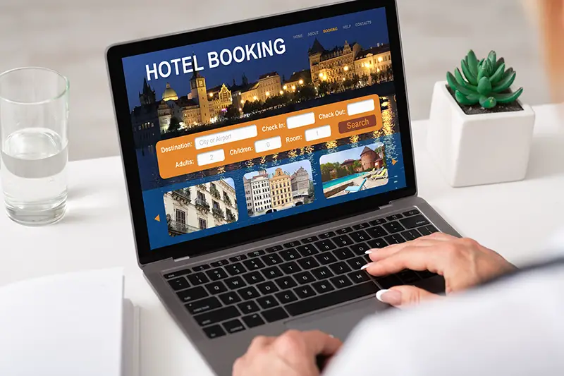 Unrecognizable businesswoman using hotel booking website