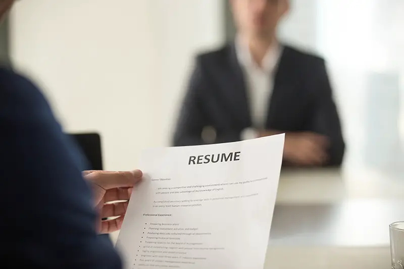 Woman Applicant and interviewer reading the resume