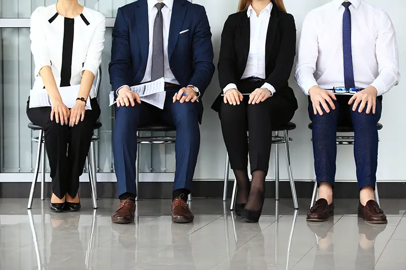 four applicants/employees sitting on the chairs