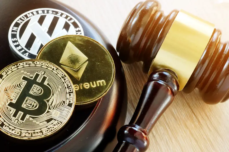 The Gavel and bitcoin cryptocurrency on the table