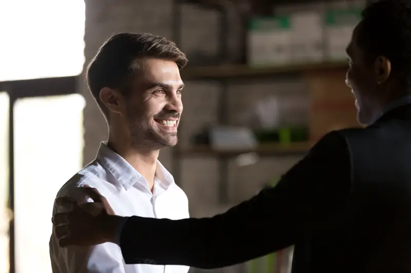 boss congratulating employee for the good work