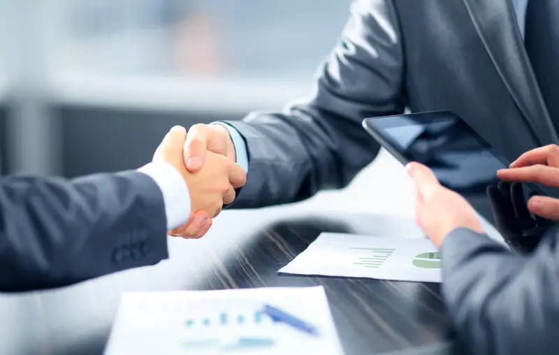 Business people shaking hands in office