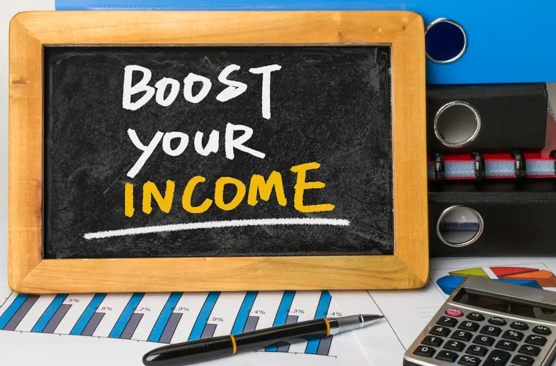 Boost your income handwritten on blackboard