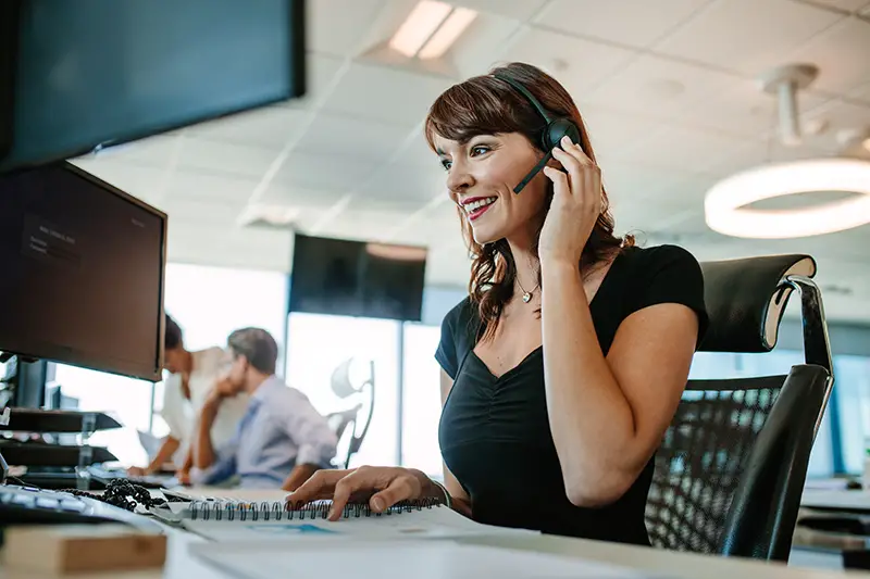 Sales representative smiling while talking to a customer