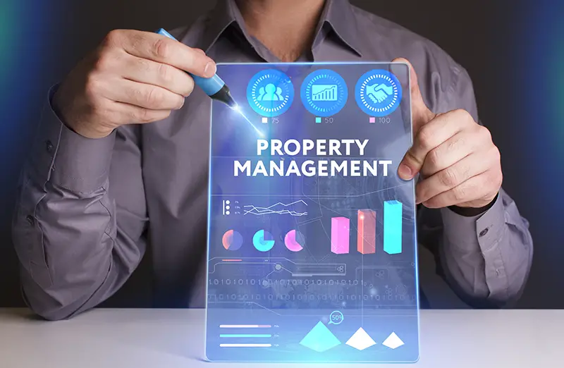 Businessman showing property management graph