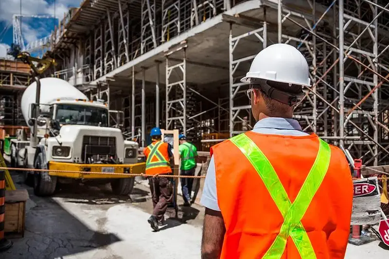 a construction worker/engineer back view in a construction site