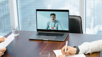 A businessman in an online meeting
