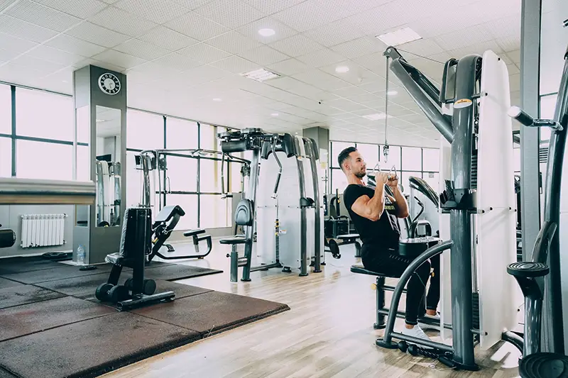 Person wearing black top and pants exercising