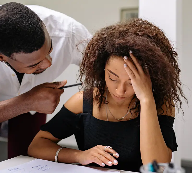 Male boss harassing his woman employee