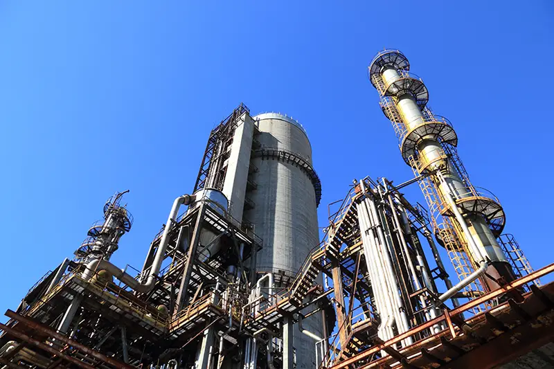 view of oil factory against blue sky