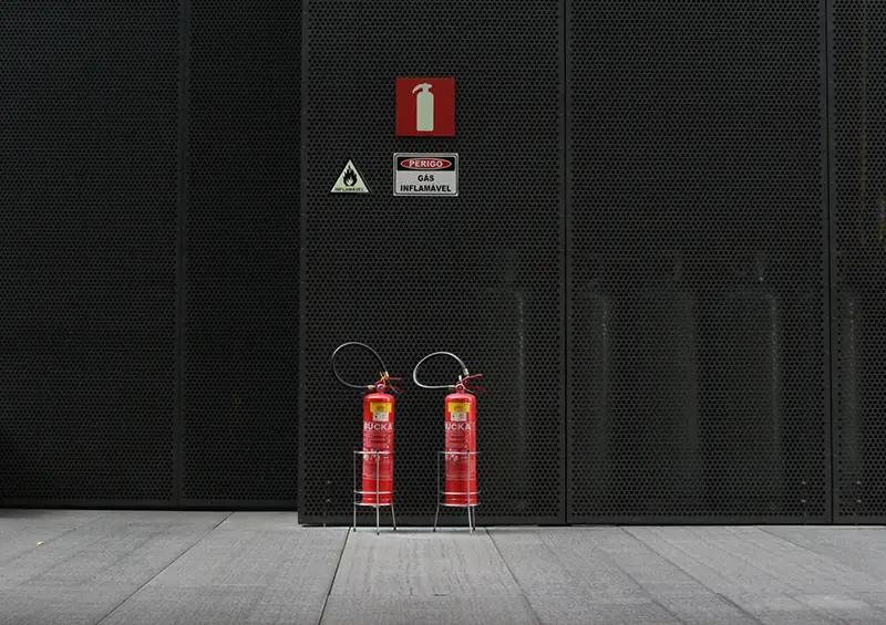 Pair of red fire extingusher tanks