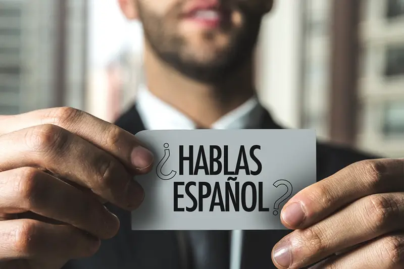 Hablas Espanol text written on white paper