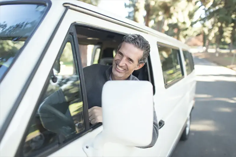 Buisnessman driving his white car