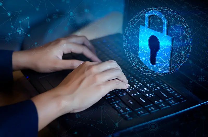 Businessman hand working on laptop, screen padlock icon on digital