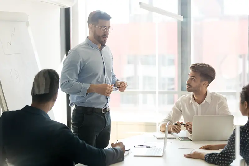 Businessman standing in front of a meeting