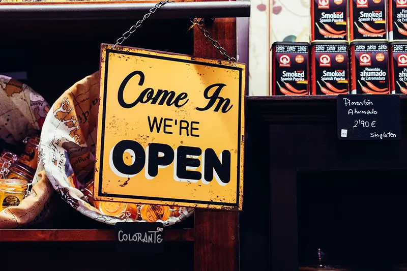 Yellow and black come in we're open signage