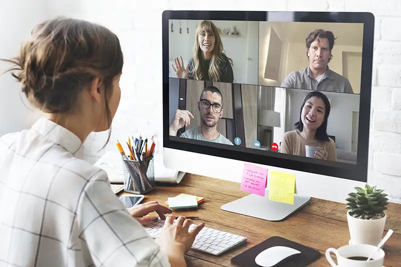 Woman in a video conference call in her home office