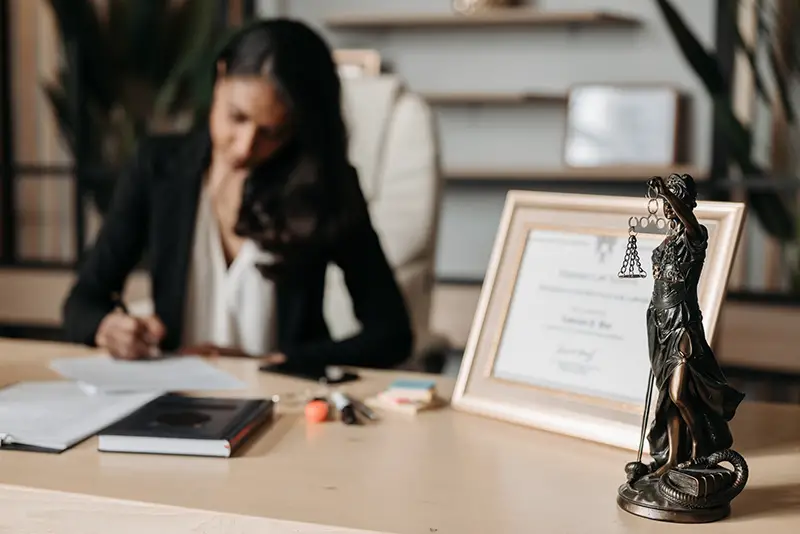 Woman lawyer working on her desk