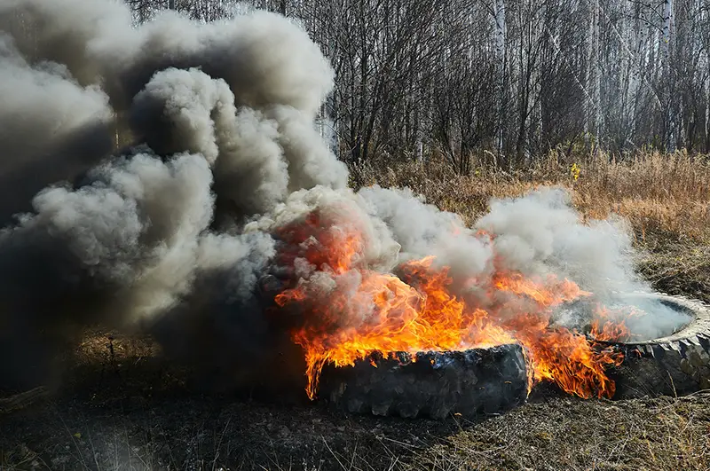 Dark smoke coming from burning tires