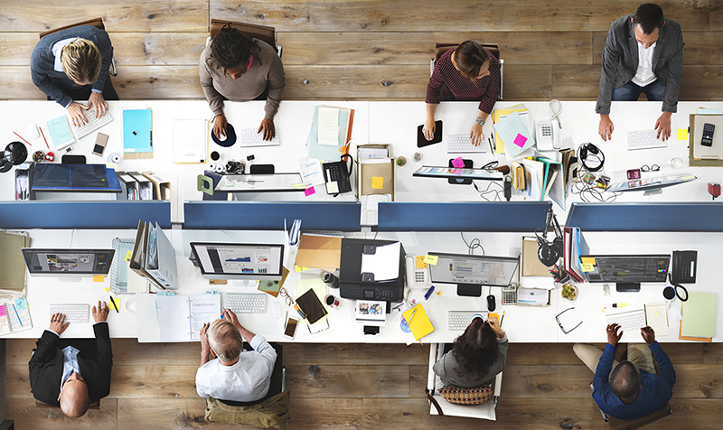 Top view of employees at work around a table