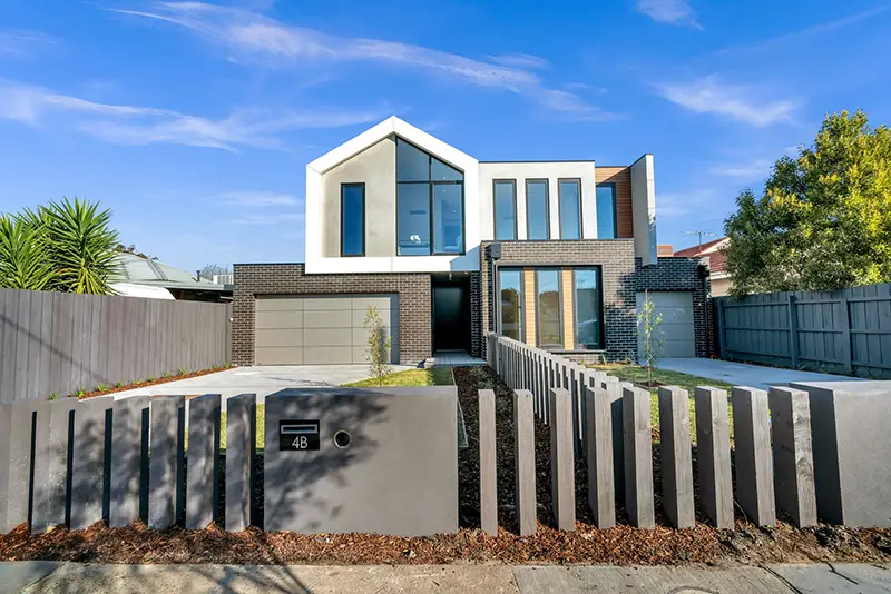 White and brown concrete building under blue sky