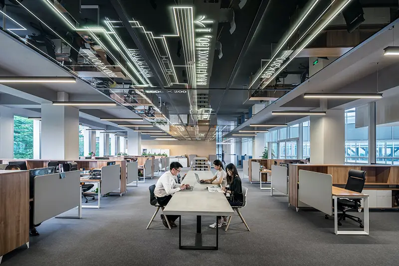 Man and woman sitting inside office building