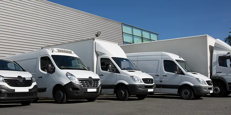 White delivery van on garage