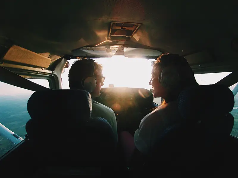 Man and woman talking inside the plane