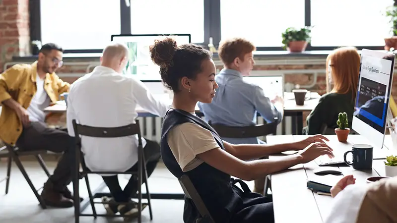 Woman using computer inside the office