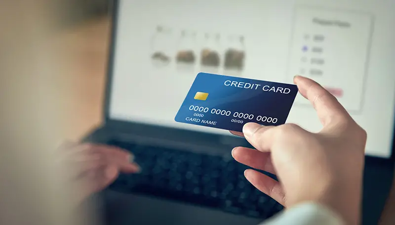 Person using credit card to pay online