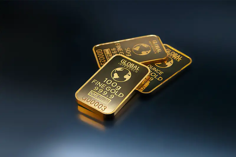 Three gold bars with dark background