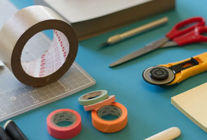 Adhesive tapes and office items on the table