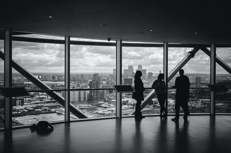 People standing inside the building in the city