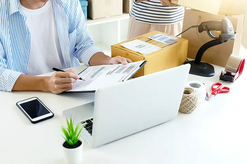 Person checking product bar codes